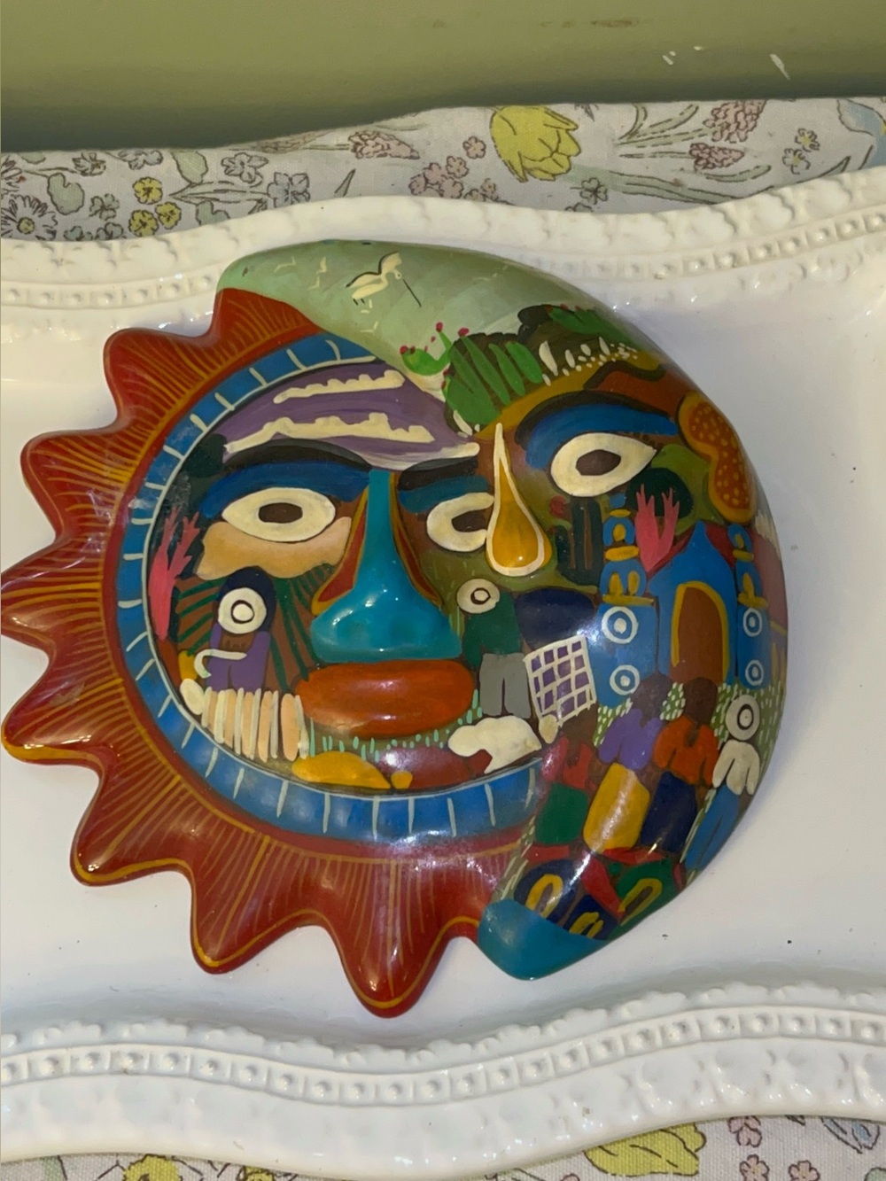 Mexican folk art terracotta sun and moon wall plaque